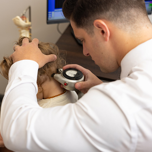 Dr. Zach Shaw helping a patient in the Wilmington office.