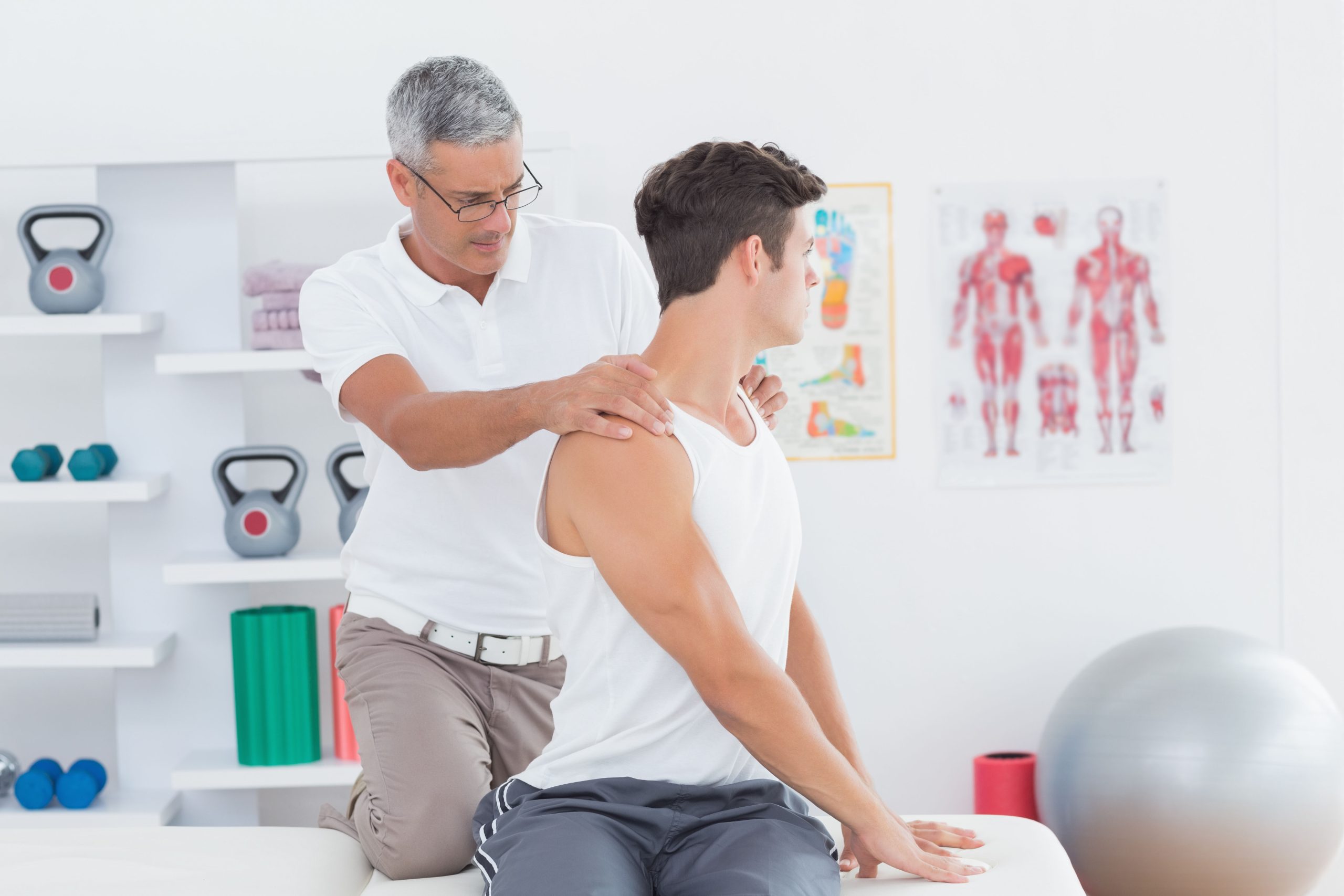 Chiropractor performing upper cervical spine adjustment to help relieve a patient’s neck pain, back pain, and vertigo in a clinical setting.